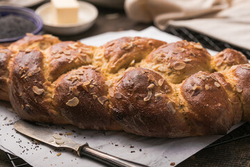 Tsoureki braid, greek easter sweet bread, on wood