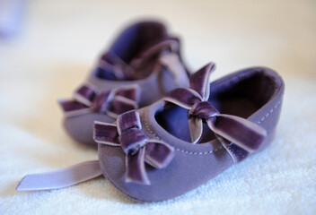 Elegant baby shoes. Indoor day photography.