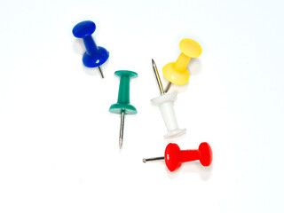 Set of push pins in different colors on white background