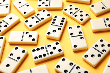 Set of classic domino tiles on yellow background