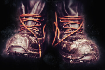 Worker boots on black background Concept of hard work Industry and manufacture