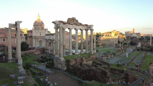 Wonderful panoramic view at sunset in ancient Roman forum remains of Temples and historical structures inherited heritage from Roman Empire age
