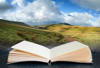 Digital composite image of Beautiful landscape of Brecon Beacons National Park in pages of open book - Powered by Adobe
