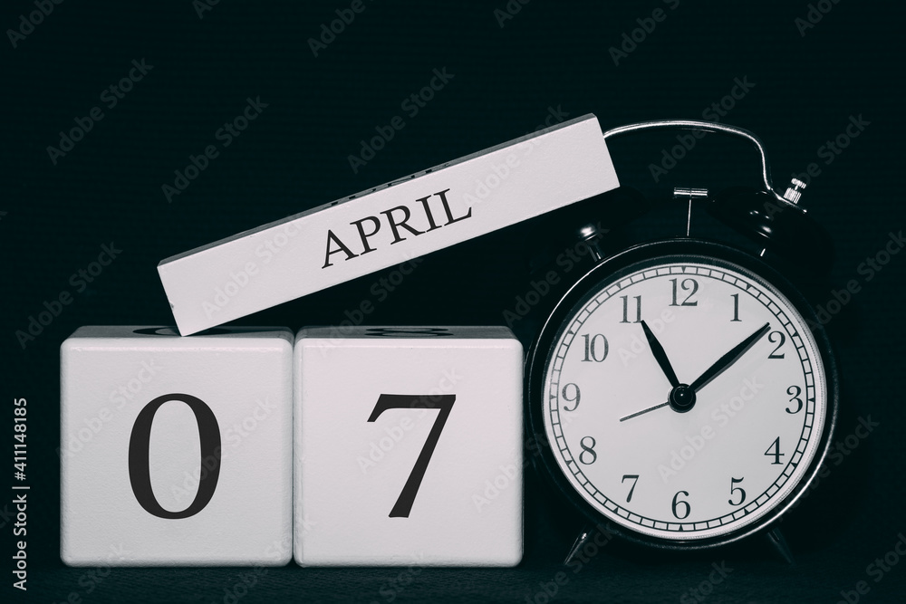 Wall mural Important date and event on a black and white calendar. Cube date and month, day 7 April. Spring season.