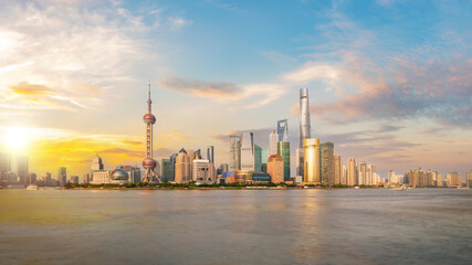 Shanghai city skyline Pudong side looking through Huangpu river on a sunny day. Shanghai, Chima. Beutiful vibrant panoramic image.