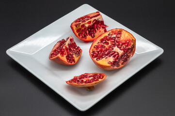 pomegranate fruit fresh on a dark background