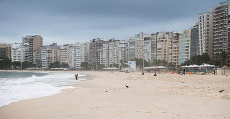  Citizens swim and sunbathe on the beach of Copacabana