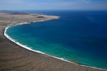View from the Mirador del Bosquecillo down to Famara and Famara beach. Lanzarote, Spain.