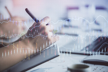 Double exposure of forex graph drawing over people taking notes background. Concept of financial...