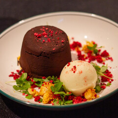 Chocolate lava cake with cream and raspberry