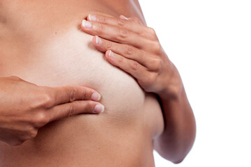 woman performs self exam on breast