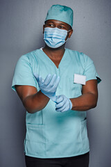 African surgeon using gloves