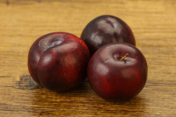 Ripe sweet plum fruit heap