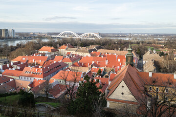 Fototapeta na wymiar Renovated roofs of the old town below the Petrovaradin fortress. Petrovaradin, Novi Sad, Serbia.