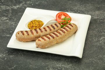 Grilled natural pork sausages with sauce