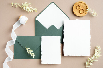 Elegant wedding stationery set. Wedding invitation cards templates, green envelopes, silk ribbon,...