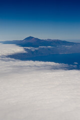 Fototapeta na wymiar Aerial view of the Pico de Teide volcano emerging from clouds, Tenerife