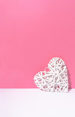Abstract white heart chilling on pink and white background