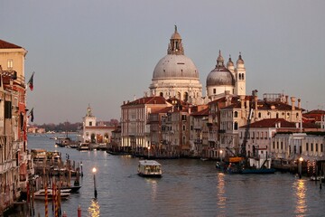 Venice, Italy - winter 2020: view on Grand Canal and Basilica della Salute during sunset