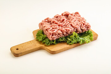 Raw pork minced meat over board