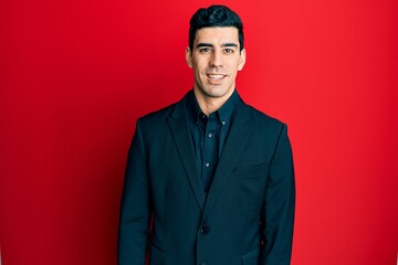 Handsome hispanic man wearing business clothes with a happy and cool smile on face. lucky person.