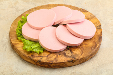 Sliced sausage snak over board