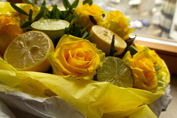 Citrus floral bouquet with yellow roses and lemons vitamin healthy lifestyle holiday concept  