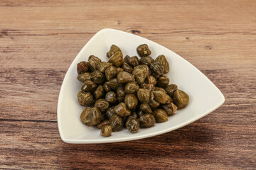 Tasty capers in the bowl