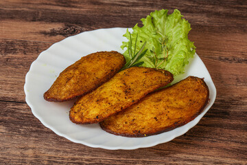 Baked potato with herbs and spices