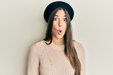 Young brunette woman wearing french look with beret afraid and shocked with surprise expression, fear and excited face.