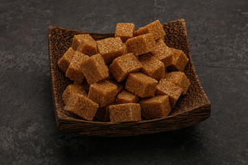 Cane sugar cubs in the bowl