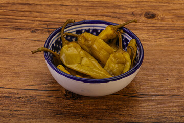 Marinated spicy and hot green pepper