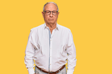 Senior caucasian man wearing business shirt and glasses depressed and worry for distress, crying angry and afraid. sad expression.