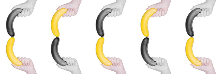yellow and black banana held in the hand