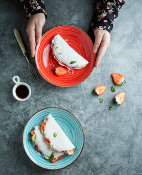 Brazilian Stuffed Tapioca crepes. Flatbread made from cassava with strawberry and banana.