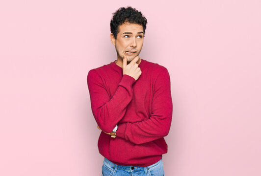 Young handsome man wearing casual clothes thinking worried about a question, concerned and nervous with hand on chin