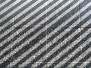 The sun light abstract shadow over the gray concrete ,sunshade shadow.