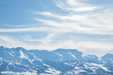 landscape snowy mountains with blue sky and clouds