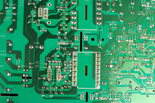 Green circuit board close up on black background