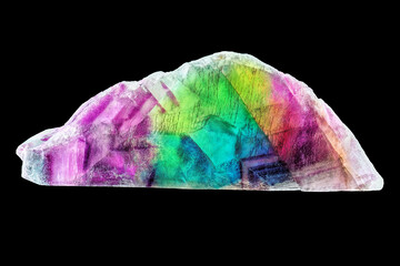 Amazing colorful macro closeup of rainbow fluorite mineral specimen isolated on black background. Natural mineral gem stone (fluorspar)