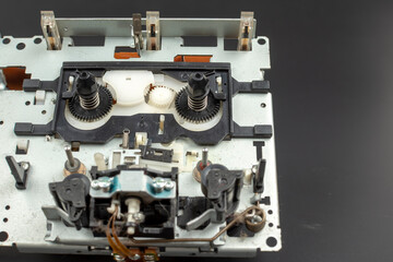 Mechanism for a tape recorder with gears in an exploded view close-up