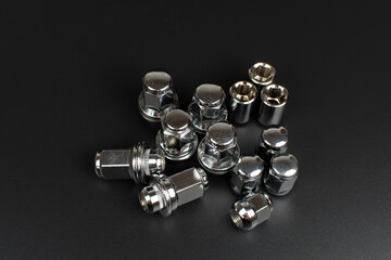 chrome wheel nuts group on black background