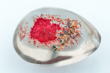 Amazing colorful crystal egg with phantom ghosts inclusion on white background