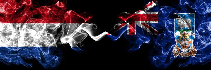 Netherlands vs British, Britain, Falkland Islands smoky mystic flags placed side by side. Thick colored silky abstract smoke flags.