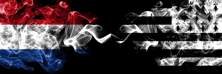Netherlands vs Brittany, Bretagne, Bretons smoky mystic flags placed side by side. Thick colored...