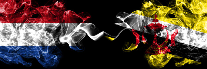 Netherlands vs Brunei, Bruneian smoky mystic flags placed side by side. Thick colored silky abstract smoke flags.