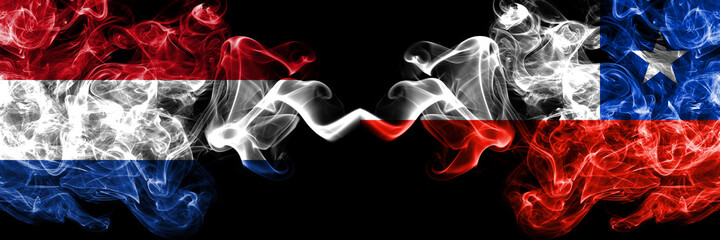 Netherlands vs Chile, Chilean smoky mystic flags placed side by side. Thick colored silky abstract smoke flags.