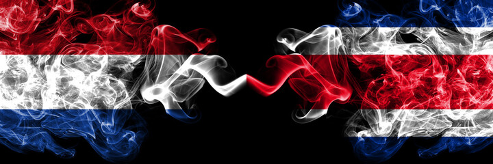 Netherlands vs Costa Rica smoky mystic flags placed side by side. Thick colored silky abstract smoke flags.