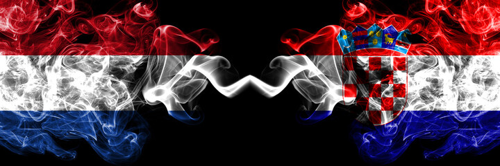 Netherlands vs Croatia, Croatian smoky mystic flags placed side by side. Thick colored silky abstract smoke flags.