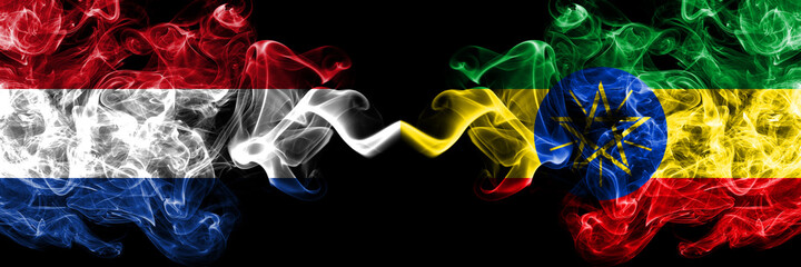 Netherlands vs Ethiopia, Ethiopian smoky mystic flags placed side by side. Thick colored silky abstract smoke flags.